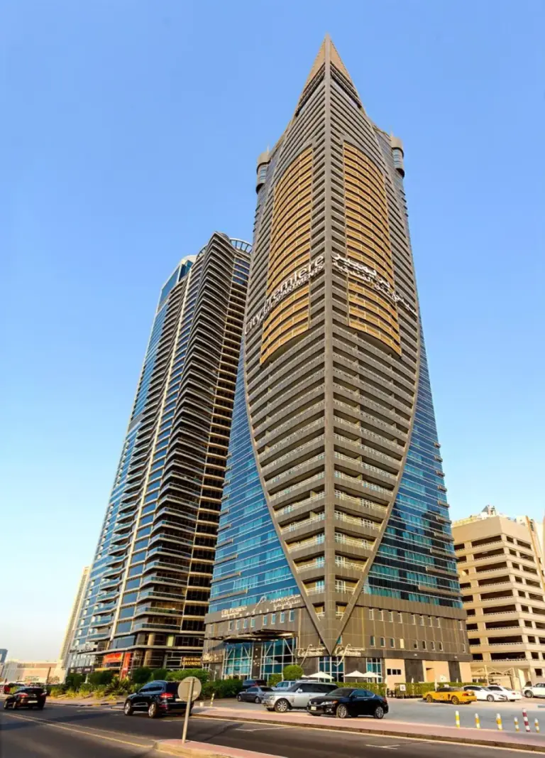 Front exterior of City Premiere Hotel Apartments Dubai with the tower facade and street view.