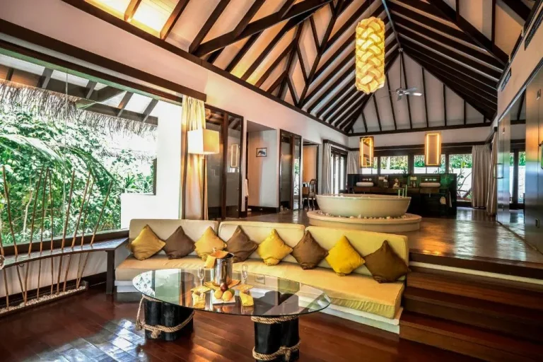Spacious living area in a villa at Coco Bodu Hithi, perfect for relaxation and leisure.