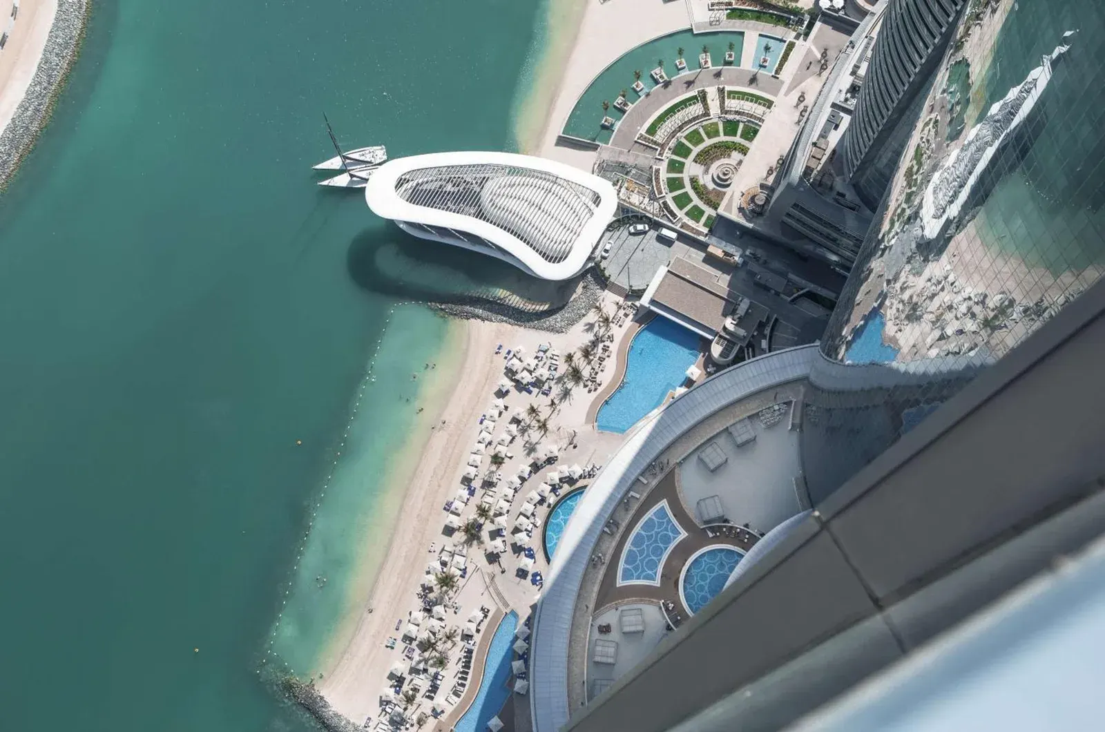 Aerial view of Conrad Abu Dhabi Etihad Towers swimming pools and beach area