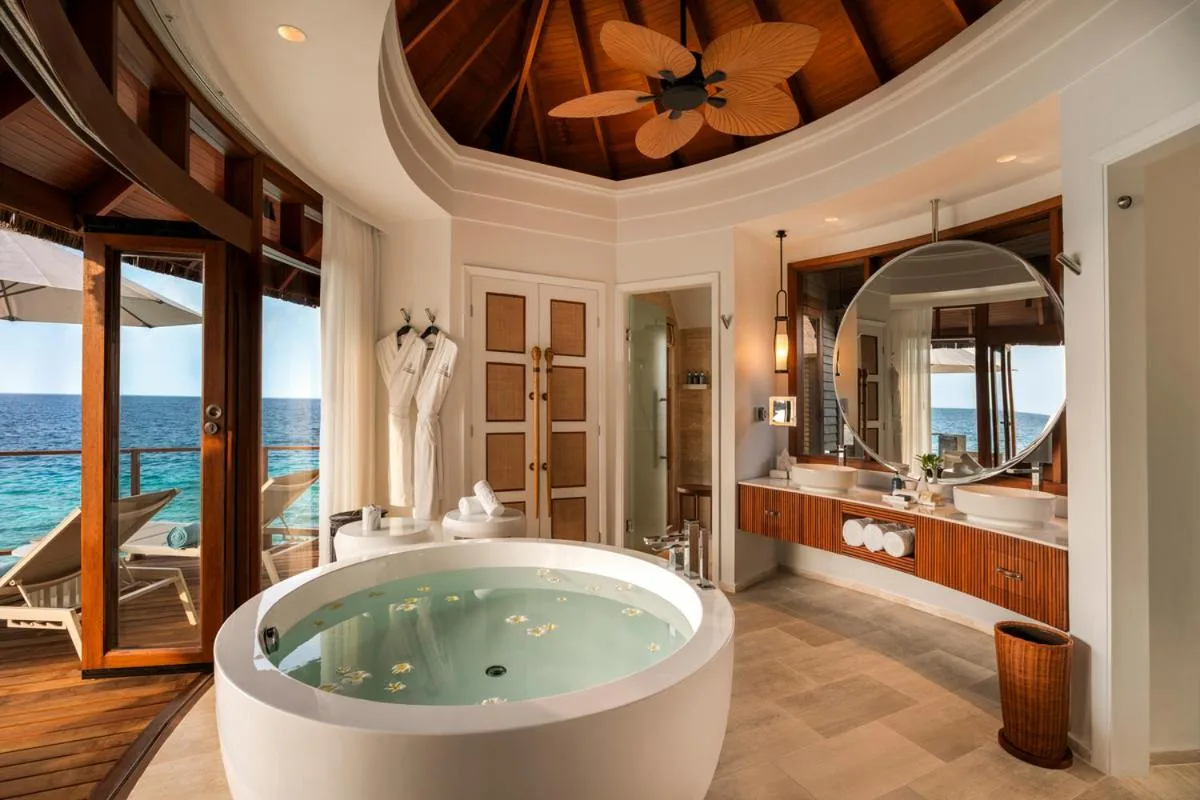 Bathroom with ocean views in a water villa at Constance Halaveli, Maldives