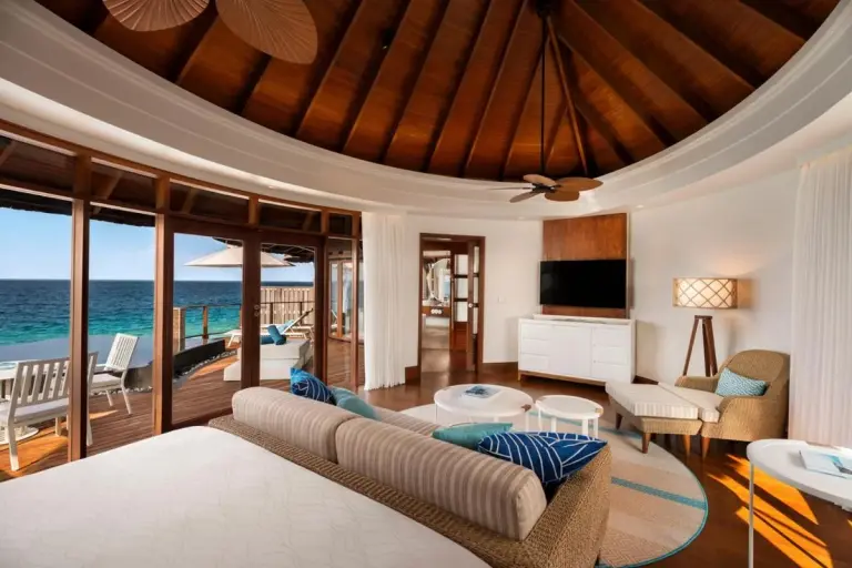 Stylish living room in a water villa at Constance Halaveli, Maldives