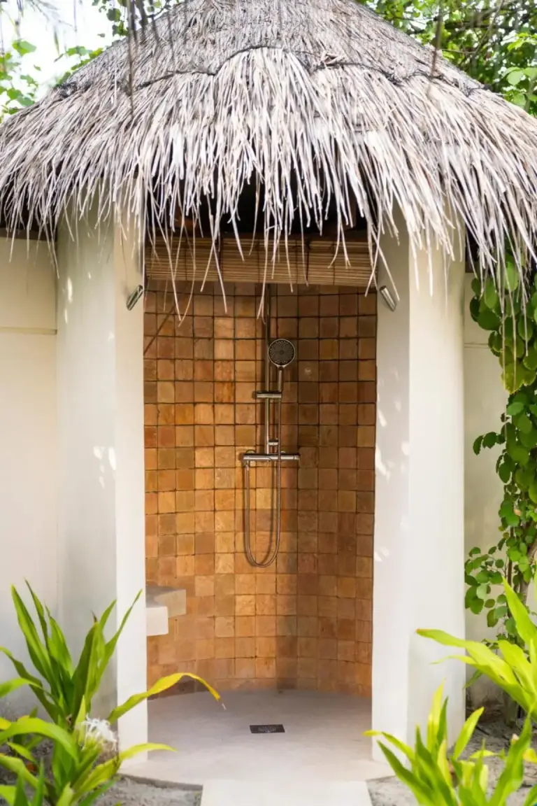 Outdoor shower in a villa at Constance Halaveli, Maldives