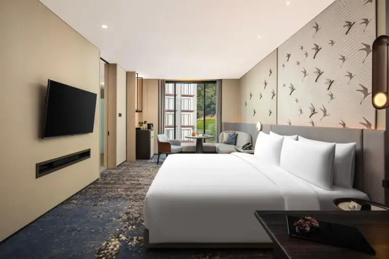 Chic hotel bedroom at Crowne Plaza Labuan Bajo featuring unique decor