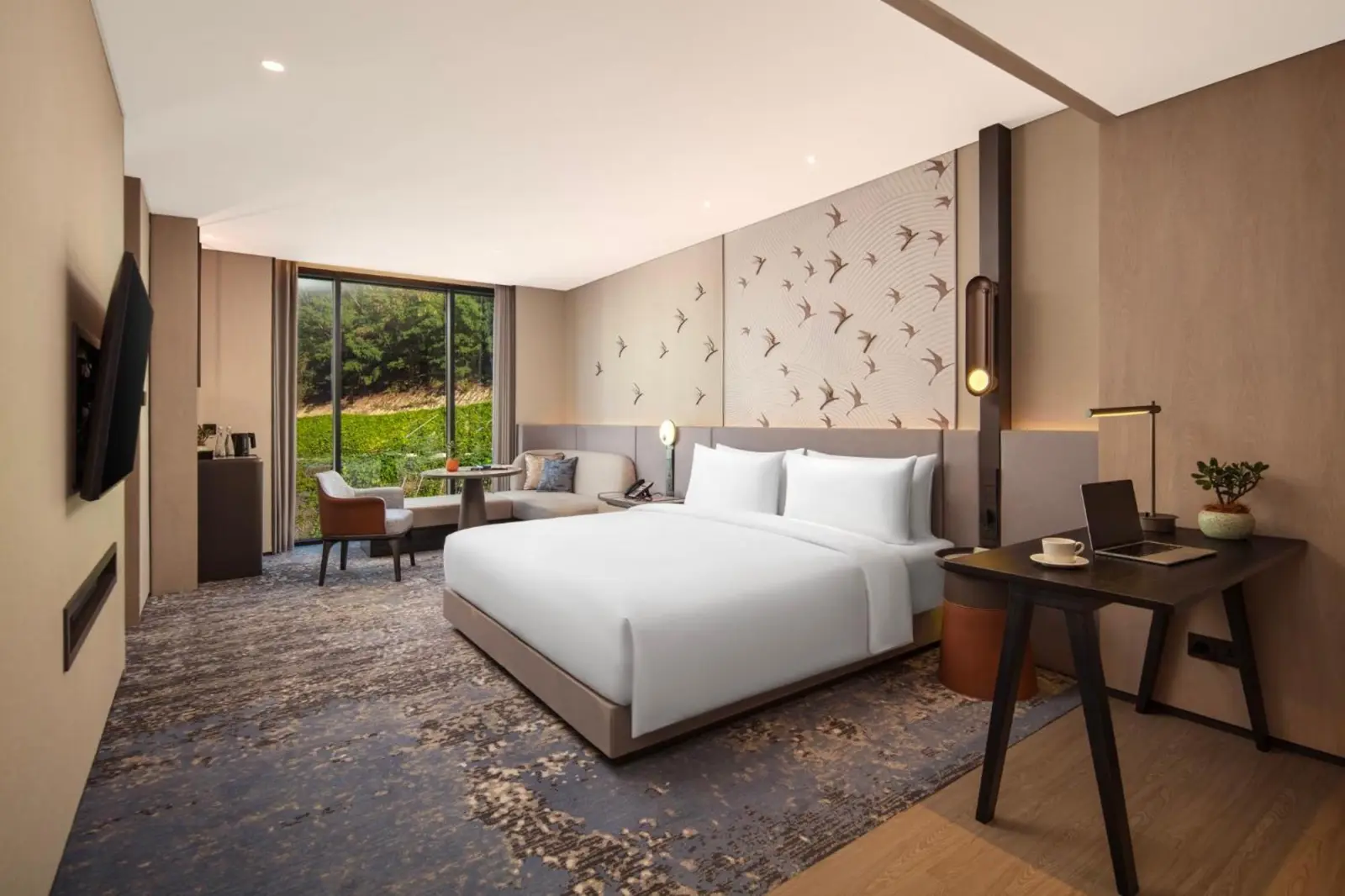 Comfortable guest room at Crowne Plaza Labuan Bajo with work desk