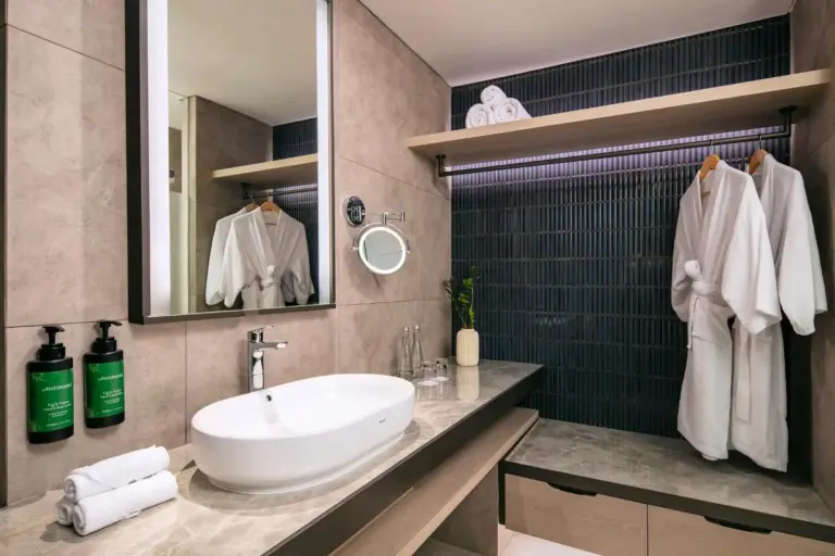 Bathroom interior at Crowne Plaza Labuan Bajo featuring modern fixtures