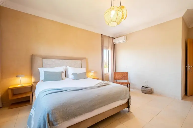 Comfortable bedroom setup at Dar Lazrek Villa & Guest House in Marrakech