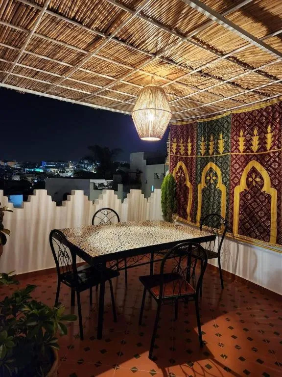 Nighttime dining area at Dar Louban House in Tangier