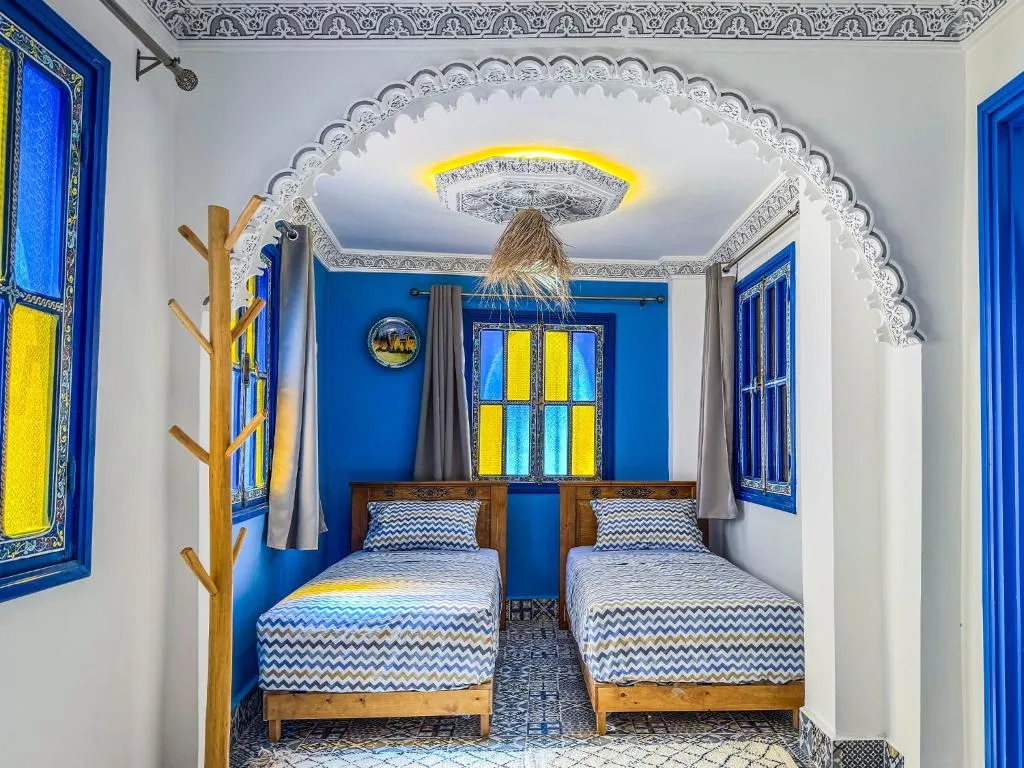Twin bedroom at Dar Sharif Tanger with colorful decor