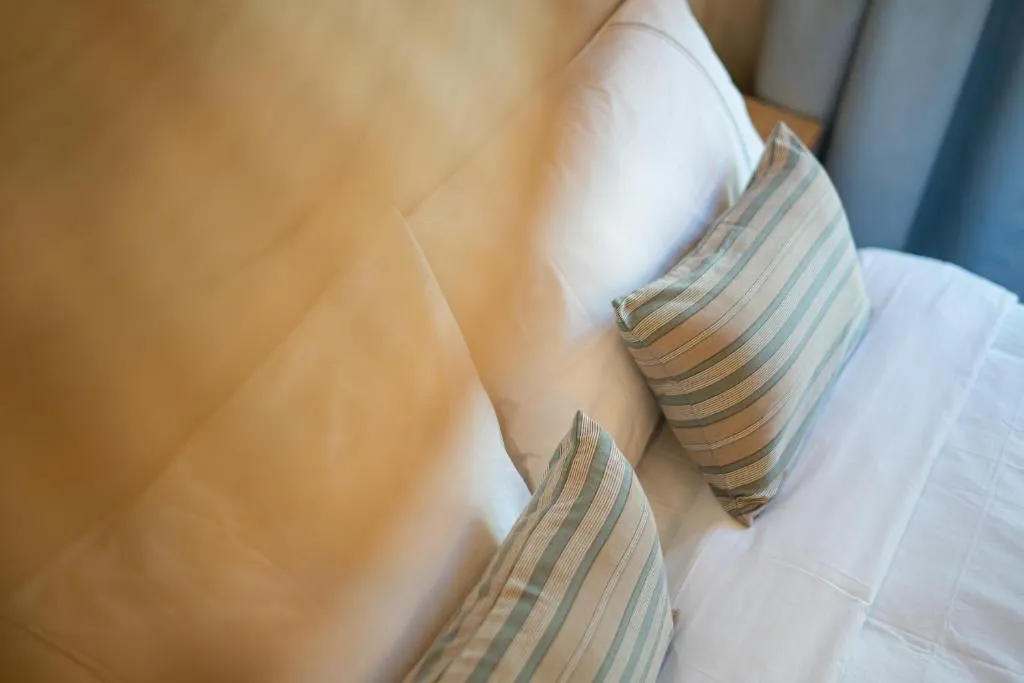 Close-up of bed pillows in Das Carretas hotel, Madrid