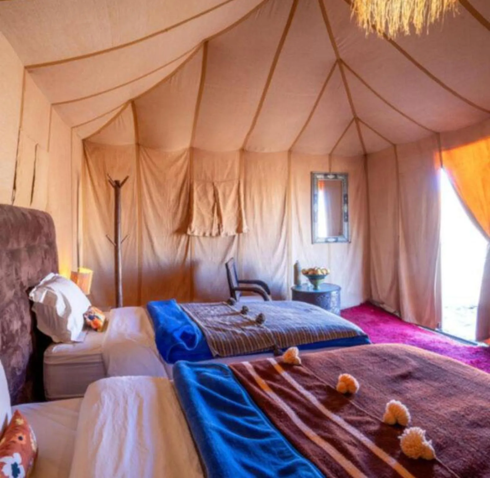 Desert Berber Luxury Camp in Merzouga family tent room with multiple beds and desert views
