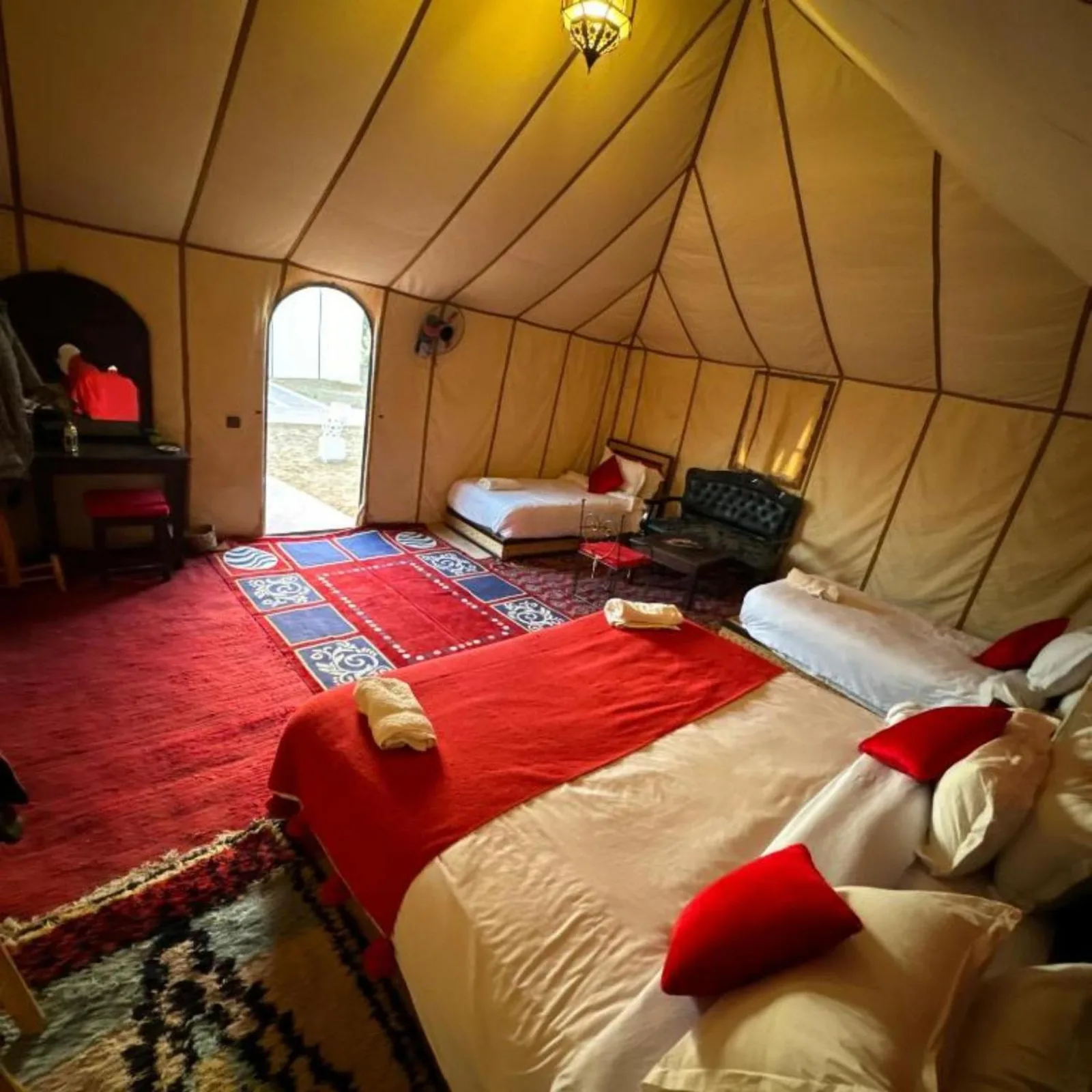 Desert camp merzouga – Merzouga, Morocco hotel – a room with a bed in a tent at Desert camp merzouga in Merzouga