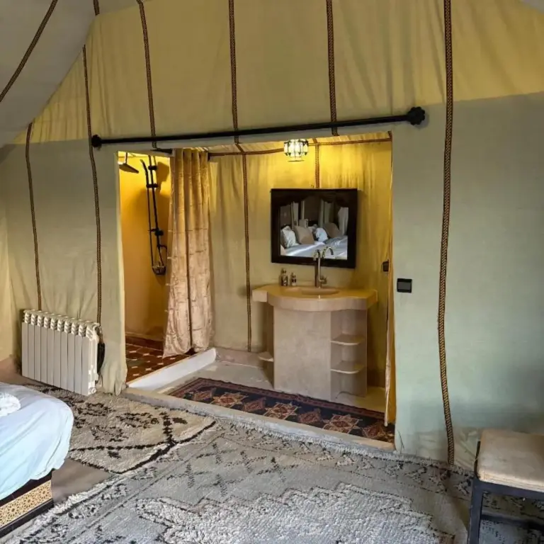 Desert camp merzouga – Merzouga, Morocco hotel – a room with a sink in a tent at Desert camp merzouga in Merzouga