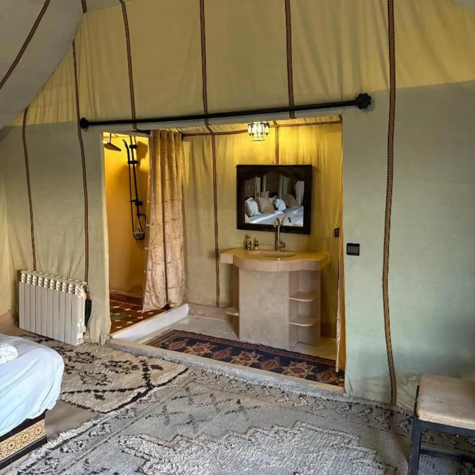 Desert camp merzouga – Merzouga, Morocco hotel – a room with a sink in a tent at Desert camp merzouga in Merzouga