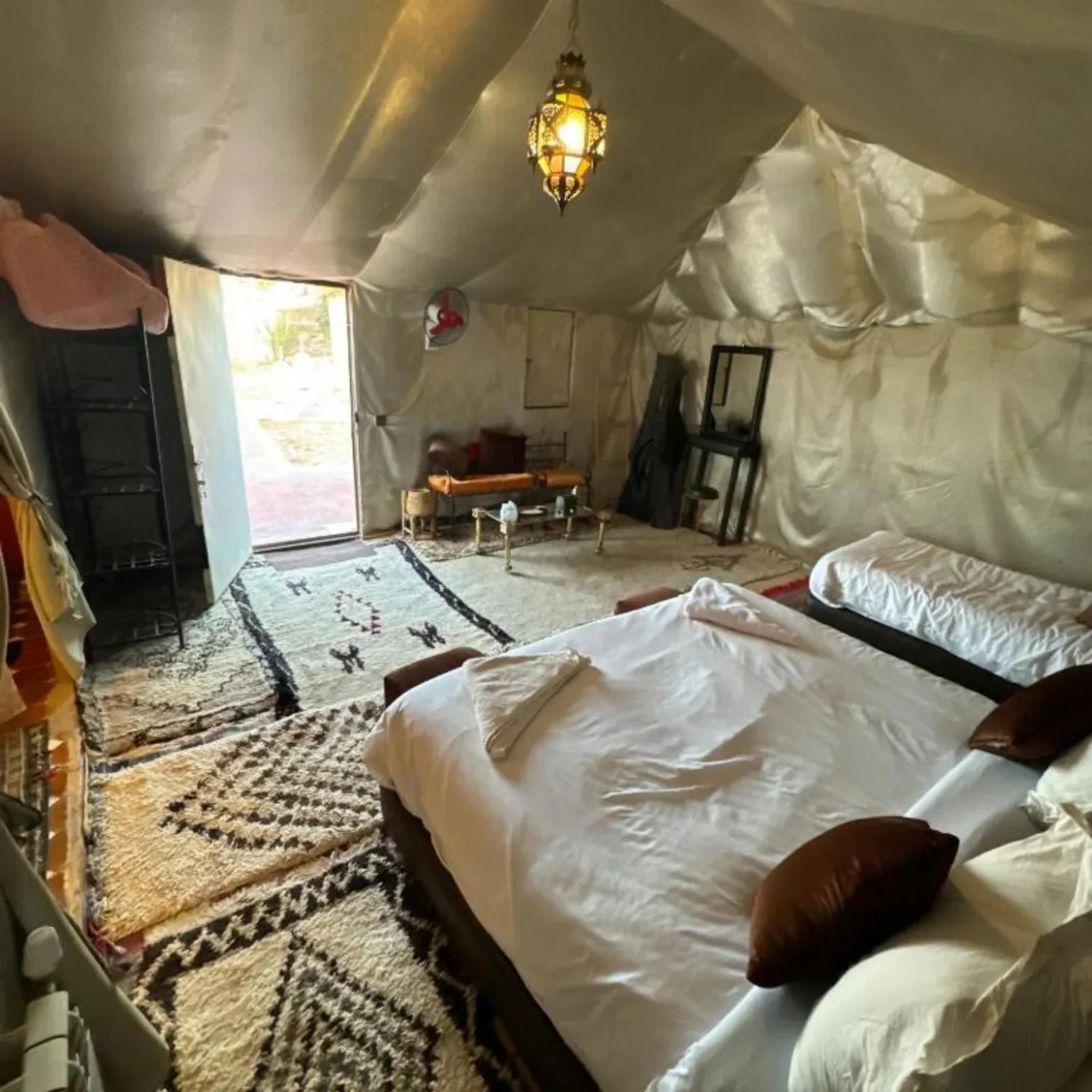 Desert camp merzouga – Merzouga, Morocco hotel – a room with two beds in a tent at Desert camp merzouga in Merzouga