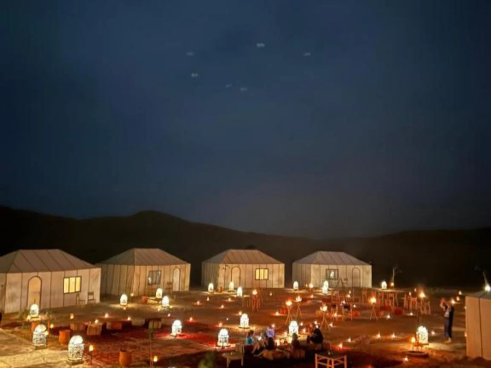 Desert Heart Luxury Camp at night showcasing luxury tents and ambiance