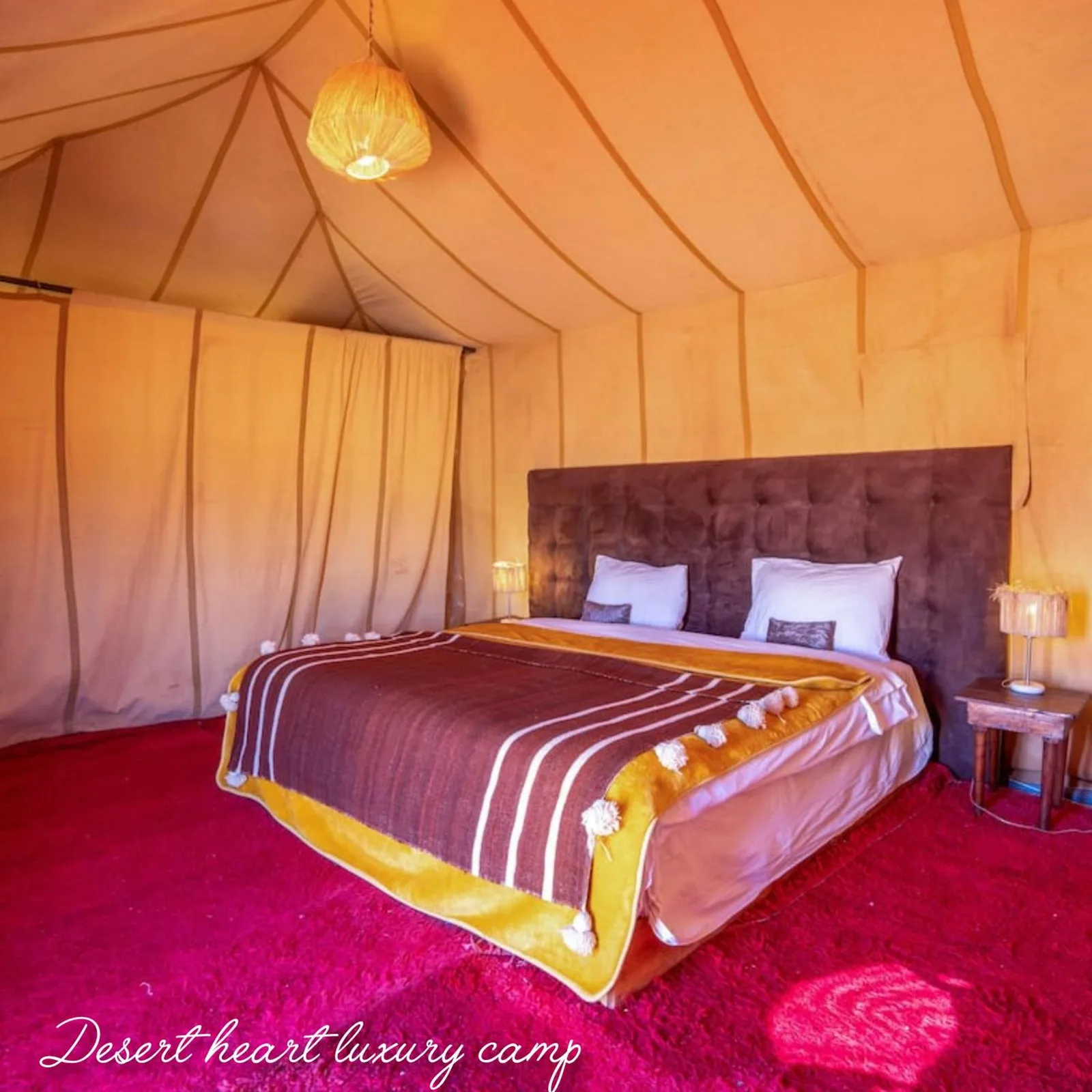 King bed tent interior at Desert Heart Luxury Camp