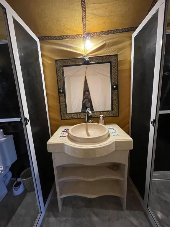 Bathroom vanity area at Desert Nights Camp