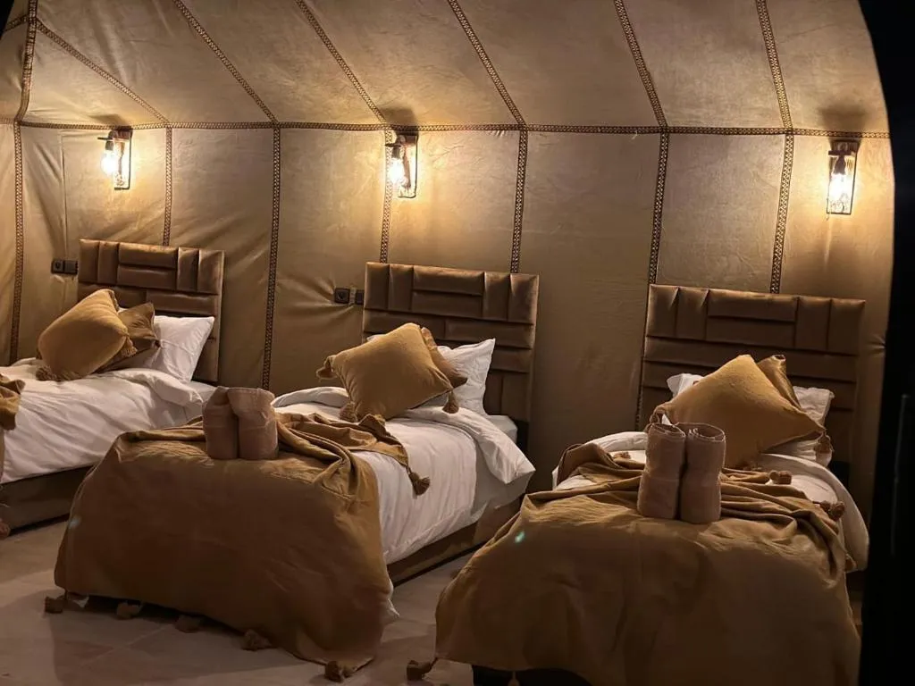 Three-bed guest room at Desert Nights Camp