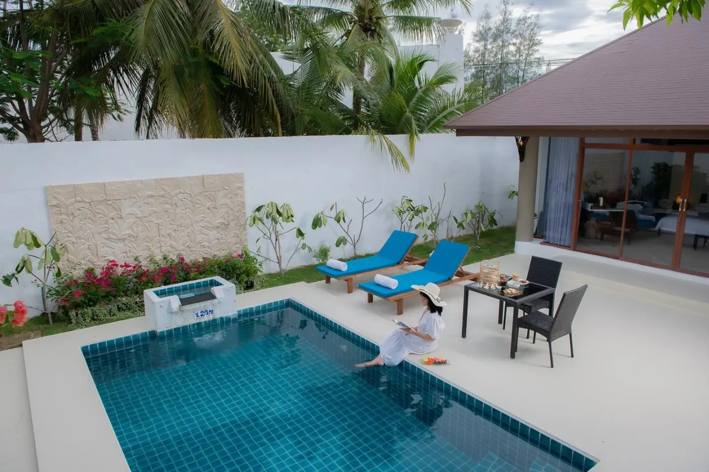 Dhevan Dara Resort & Spa Hua Hin guest enjoying poolside