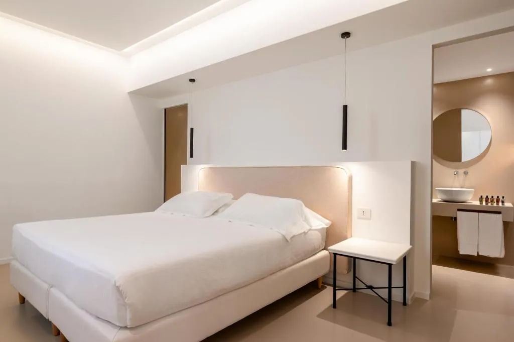 Habitación elegante de huésped en Dimora Caiammari Luxury Hotel & Spa