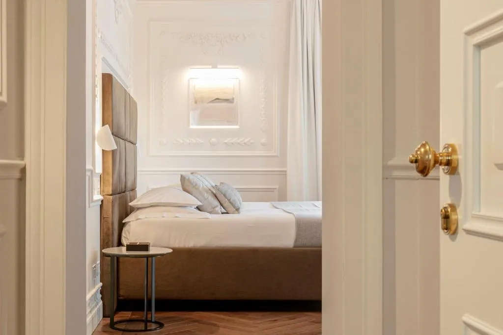 View of bedroom from hallway at Dimora Palanca Boutique & SPA