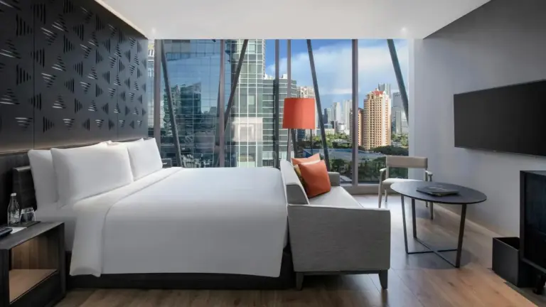Chic bedroom at Discovery SCBD Jakarta with city views