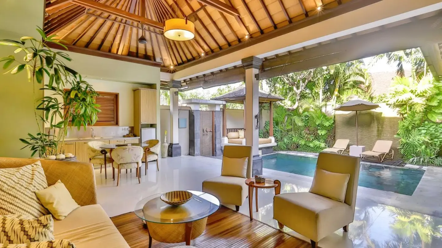 Open-plan living room at DISINI Luxury Spa Villas-CHSE Certified in Seminyak overlooking the private pool and garden