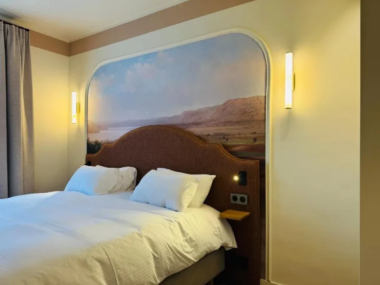 Domaine d'Auriac - Relais & Châteaux cozy bedroom with scenic artwork