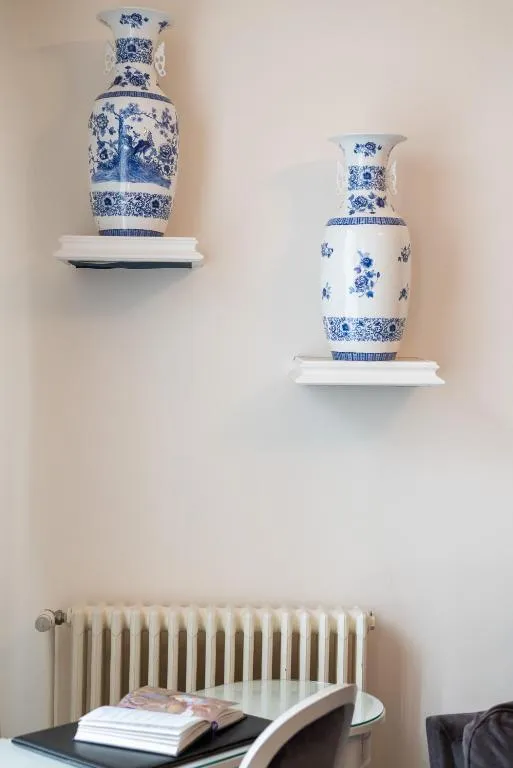 Domaine d'Auriac - Relais & Châteaux decorative vases on the wall