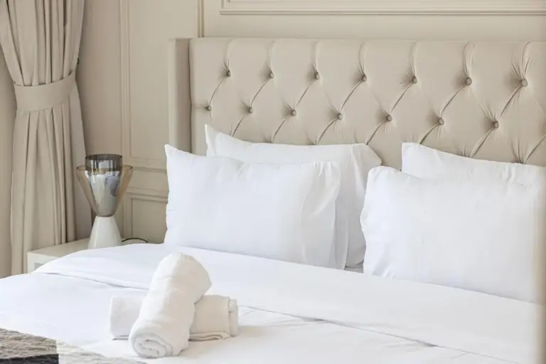 Close-up of luxury hotel bedding and towels in Downtown Dubai.