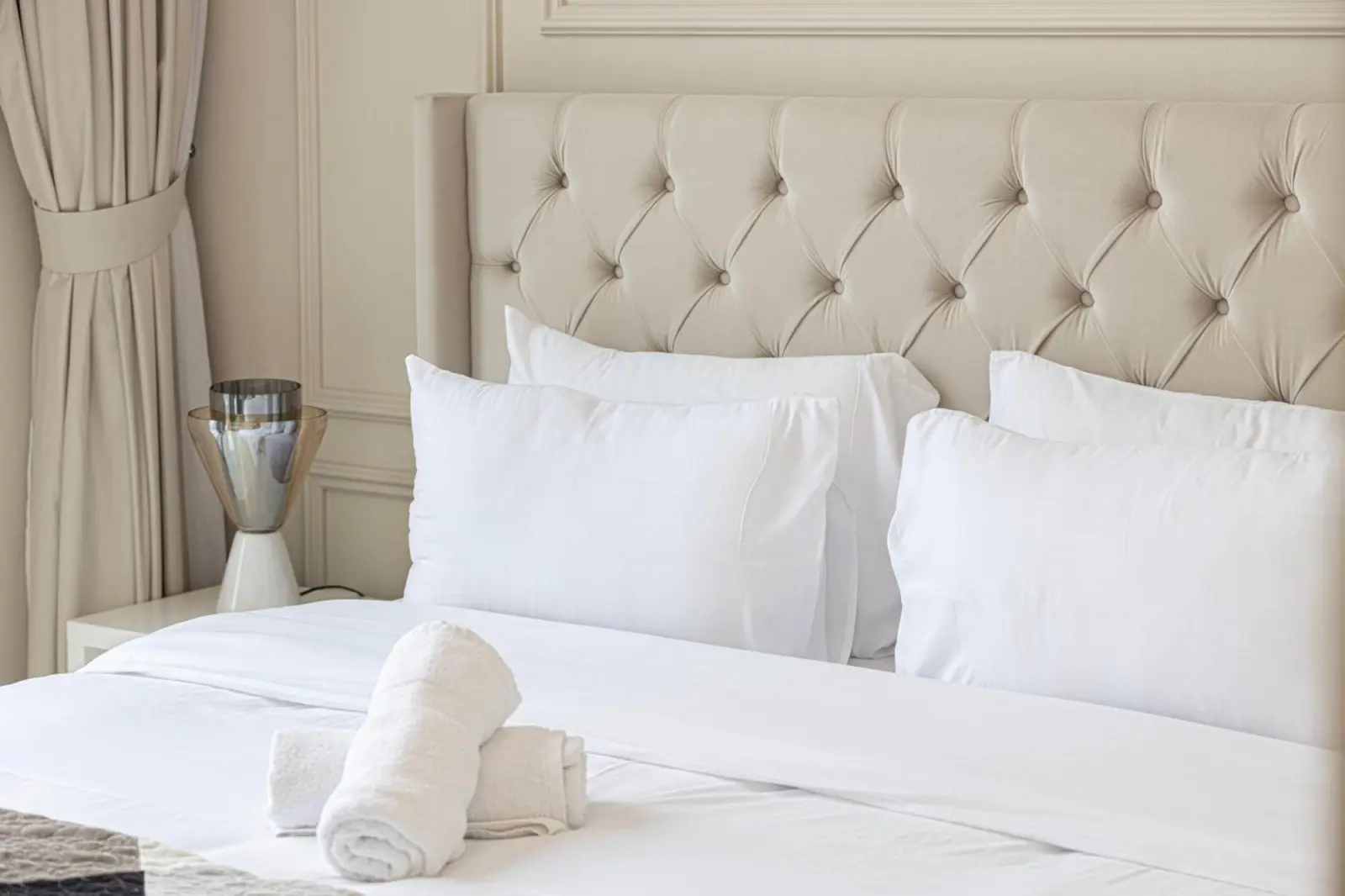 Close-up of luxury hotel bedding and towels in Downtown Dubai.