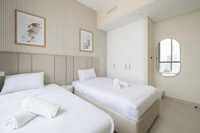 Cozy twin bedroom setup in hotel, Downtown Dubai.