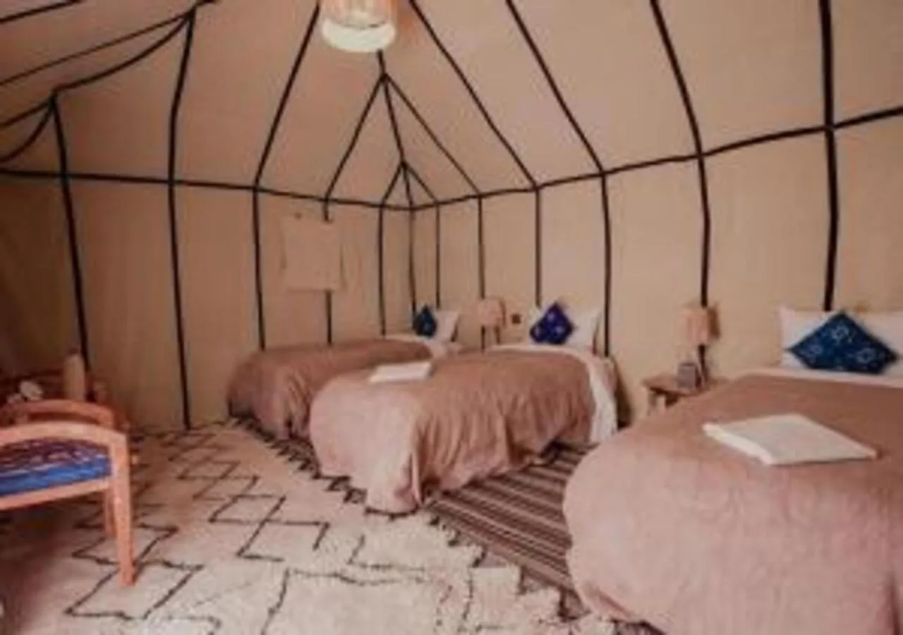 Triple tent room at Dune Majesty Luxury Camp Merzouga with three beds