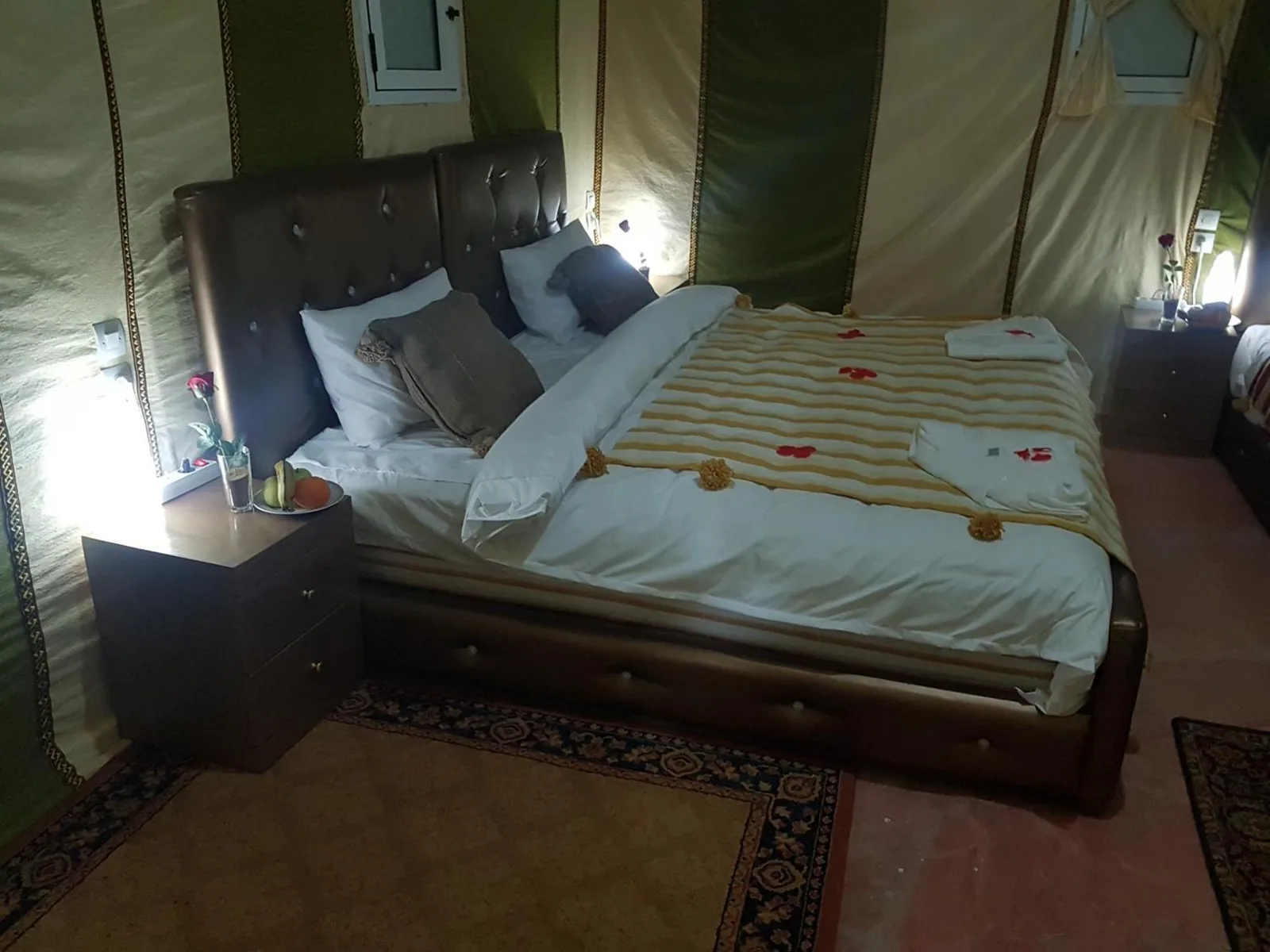 Double bed inside a tent room at Dune Merzouga Camp in Merzouga
