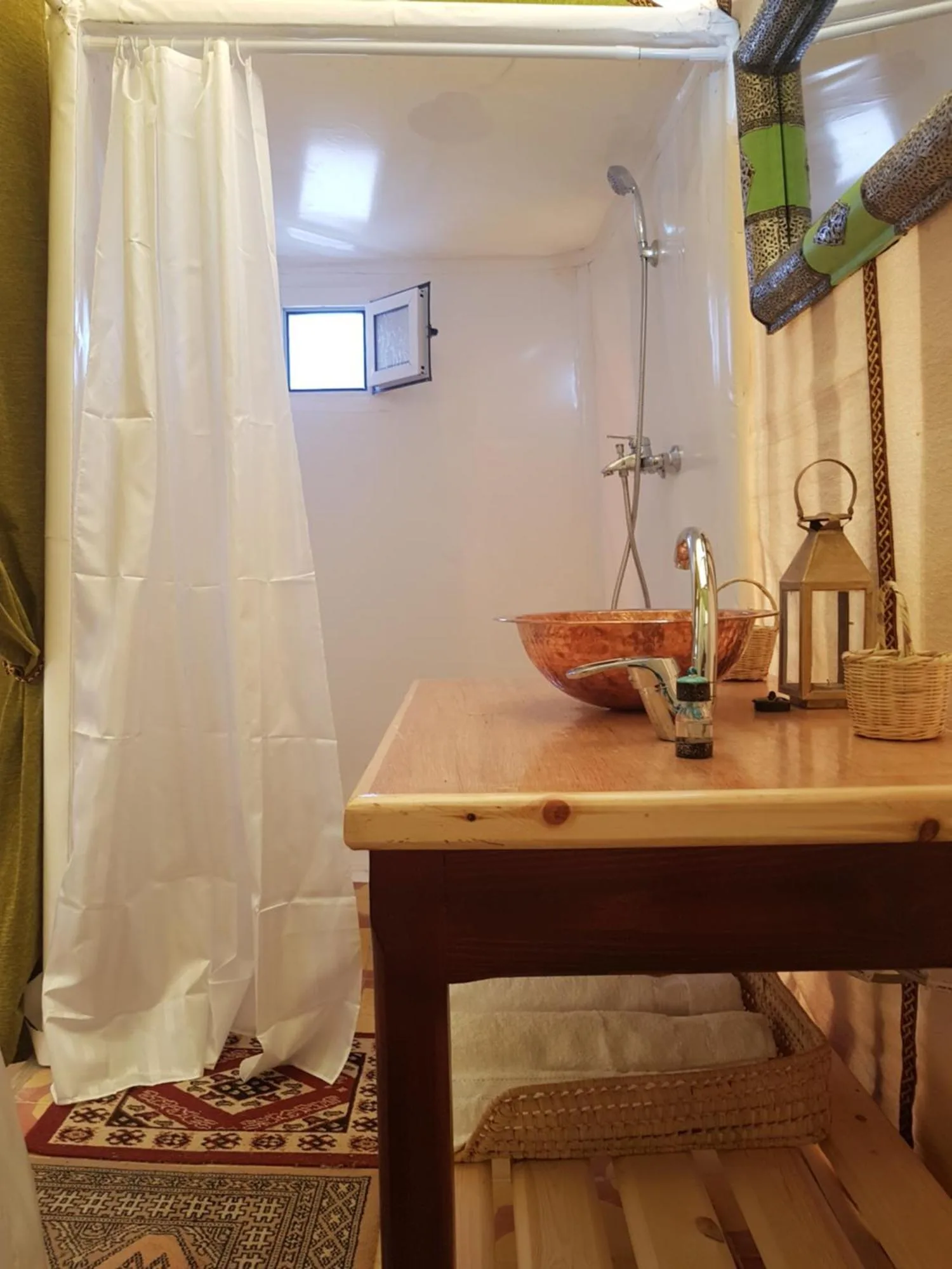 Private bathroom inside Dune Merzouga Camp in Merzouga with shower and copper sink