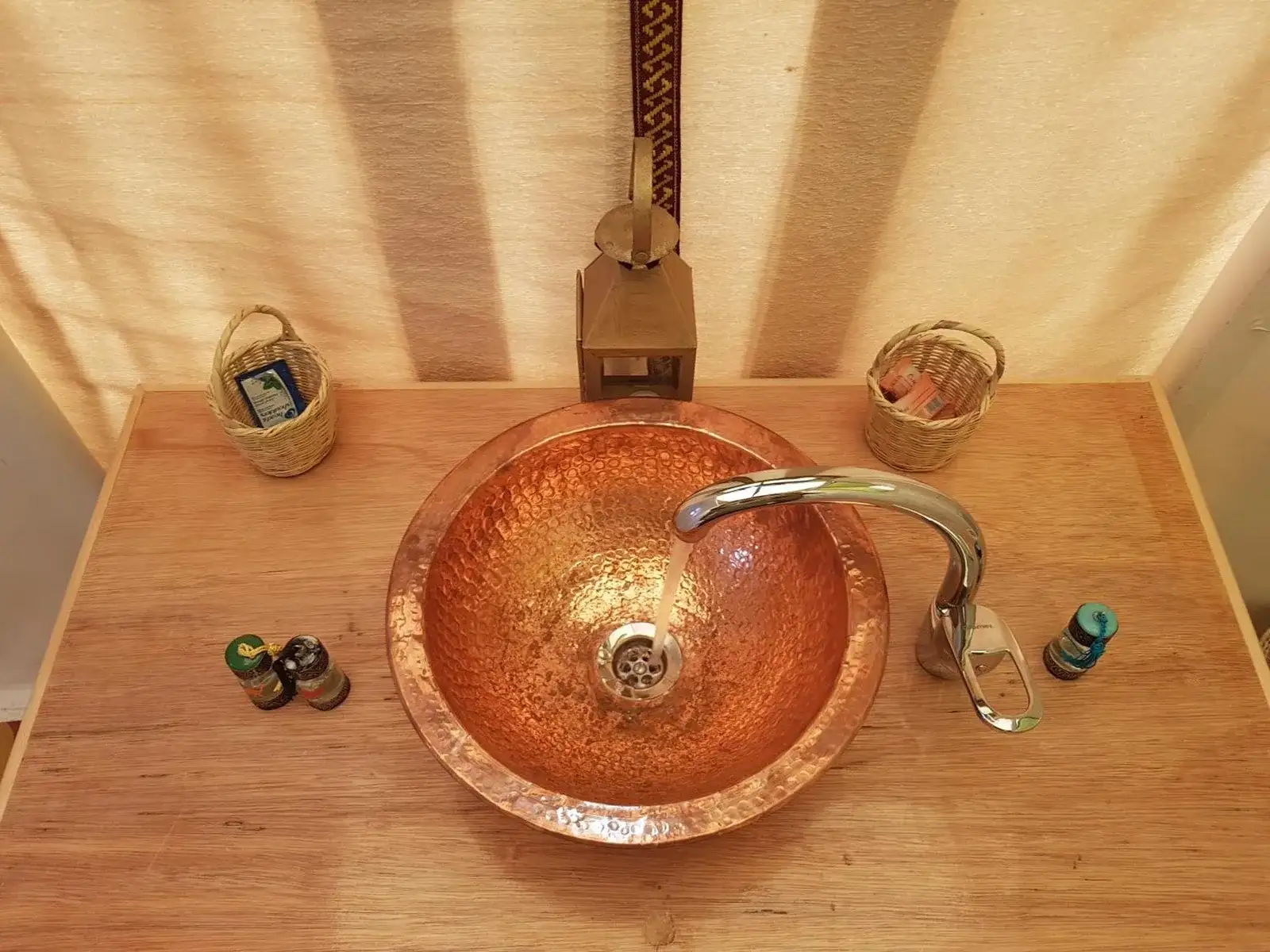 Copper sink vanity in the bathroom at Dune Merzouga Camp in Merzouga
