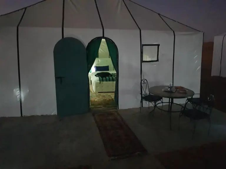 Exterior of a private tent at Dune Merzouga Camp in Merzouga with seating area