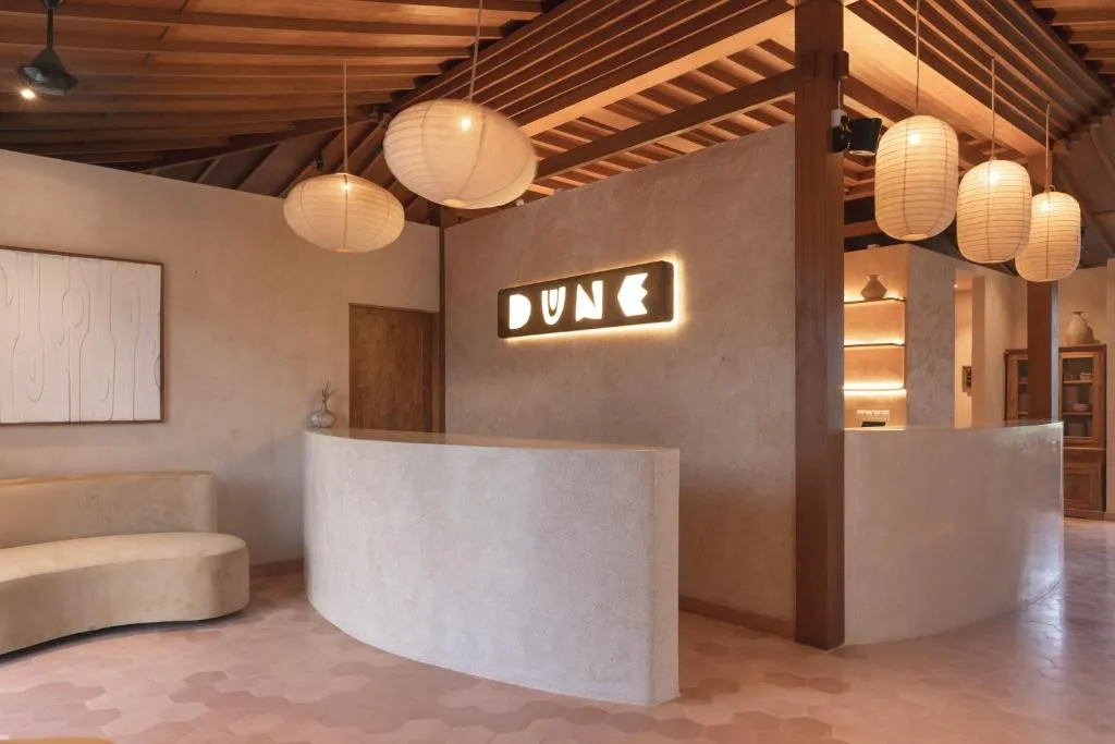 Dune Seseh reception desk with warm lighting