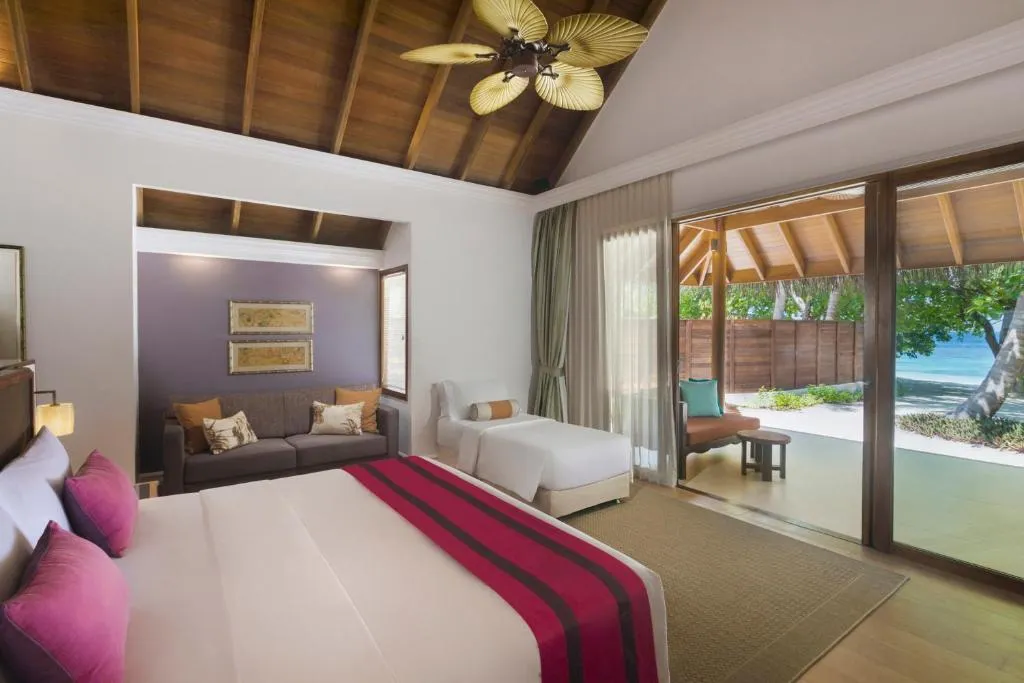 Cadre romantique pour un dîner au coucher de soleil au Dusit Thani Maldives
