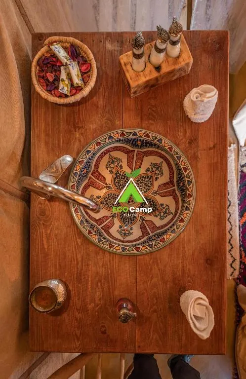 Eco Desert Camp dining table with local decorations.