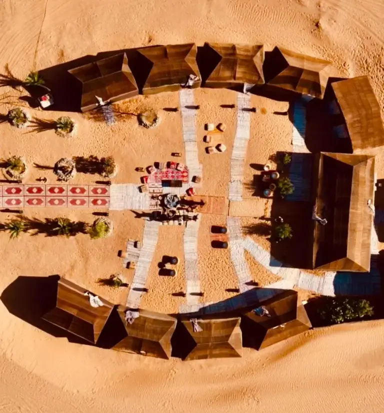 Aerial view of Eco Merzouga luxury camp in Merzouga showing the desert camp layout and outdoor common areas
