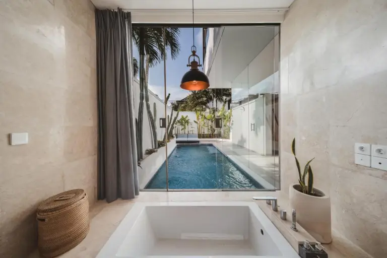 Eight Palms Villa Seminyak by Ini Vie Hospitality – Seminyak, Indonesia hotel – a bedroom with a white bed and a window at Eight Palms Villa Seminyak by Ini Vie Hospitality in Seminyak