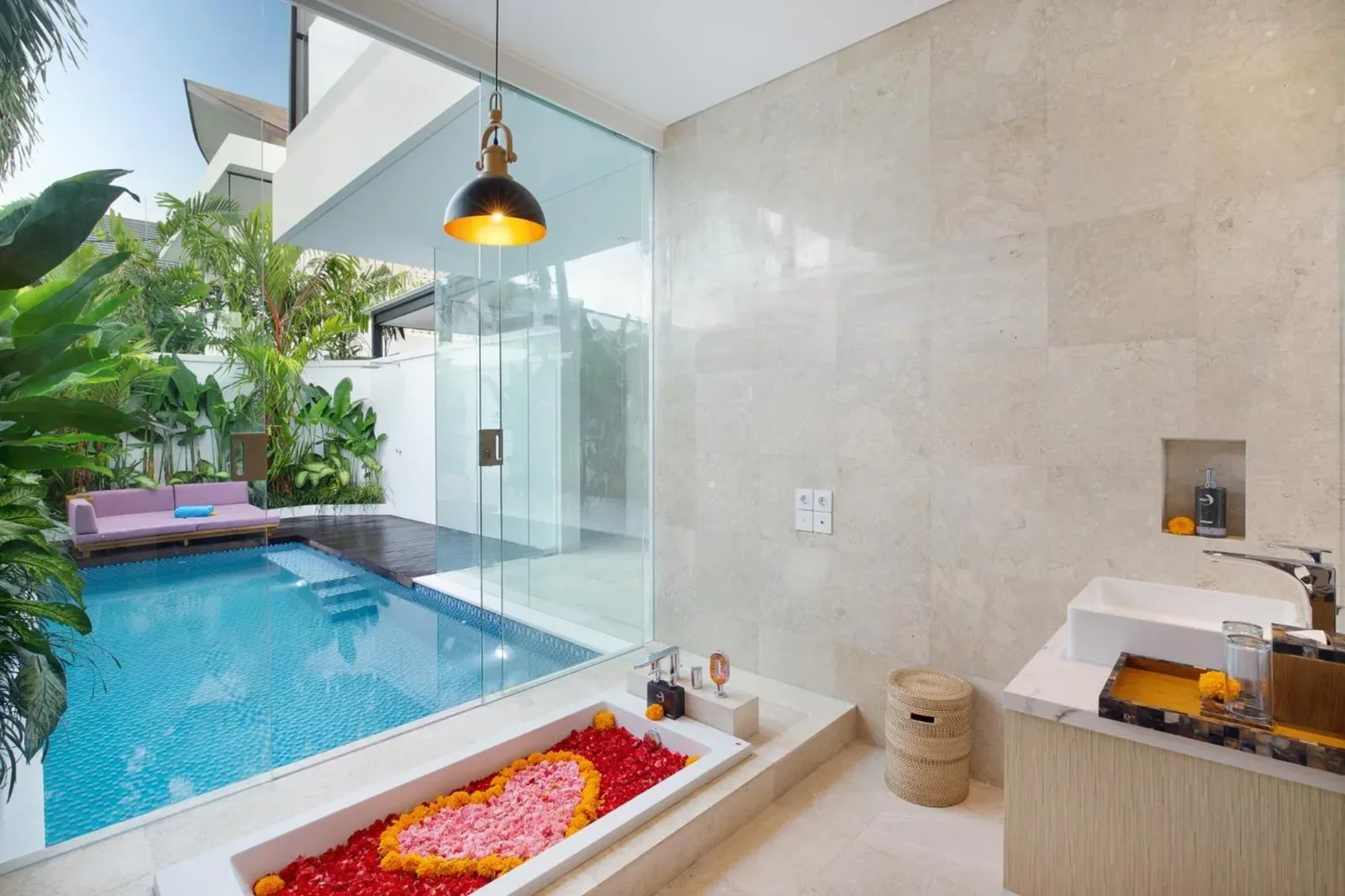 Eight Palms Villa Seminyak by Ini Vie Hospitality – Seminyak, Indonesia hotel – a woman and a boy playing in the water in a pool at Eight Palms Villa Seminyak by Ini Vie Hospitality in Seminyak