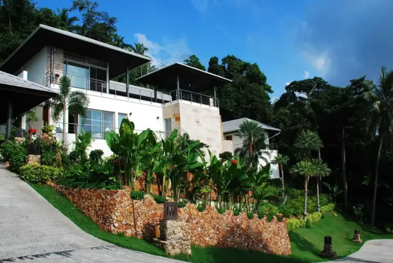 El Cid Villa exterior surrounded by lush gardens in Koh Samui