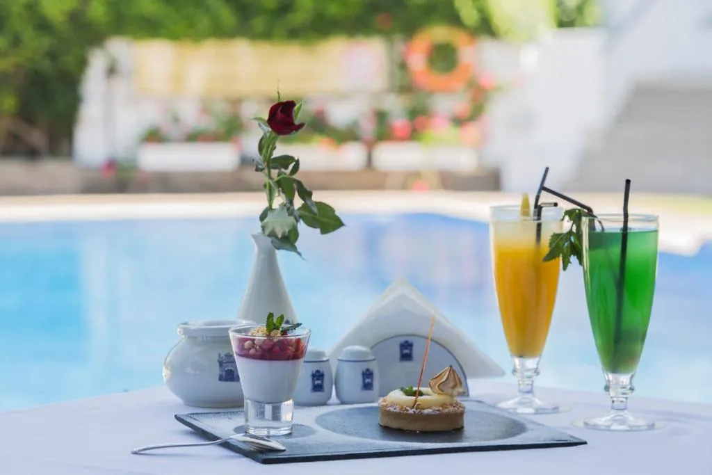 Refreshing drinks and dessert by the pool at El Minzah Hotel