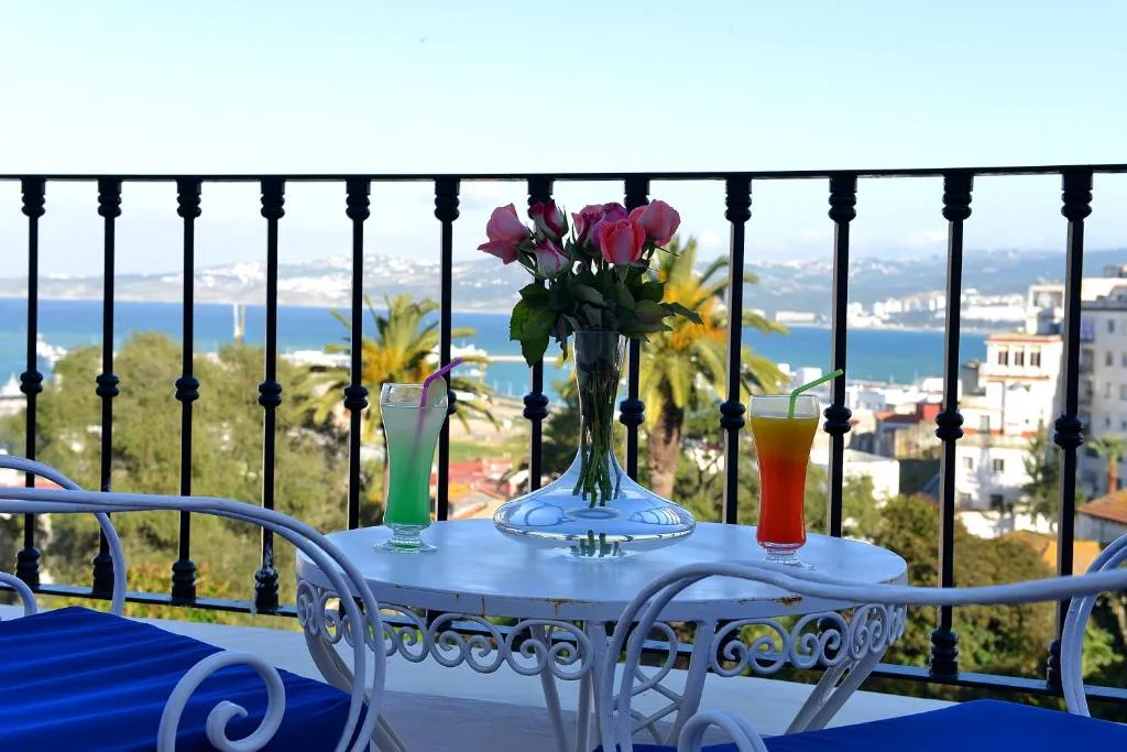 Drinks and flowers on the balcony at El Minzah Hotel