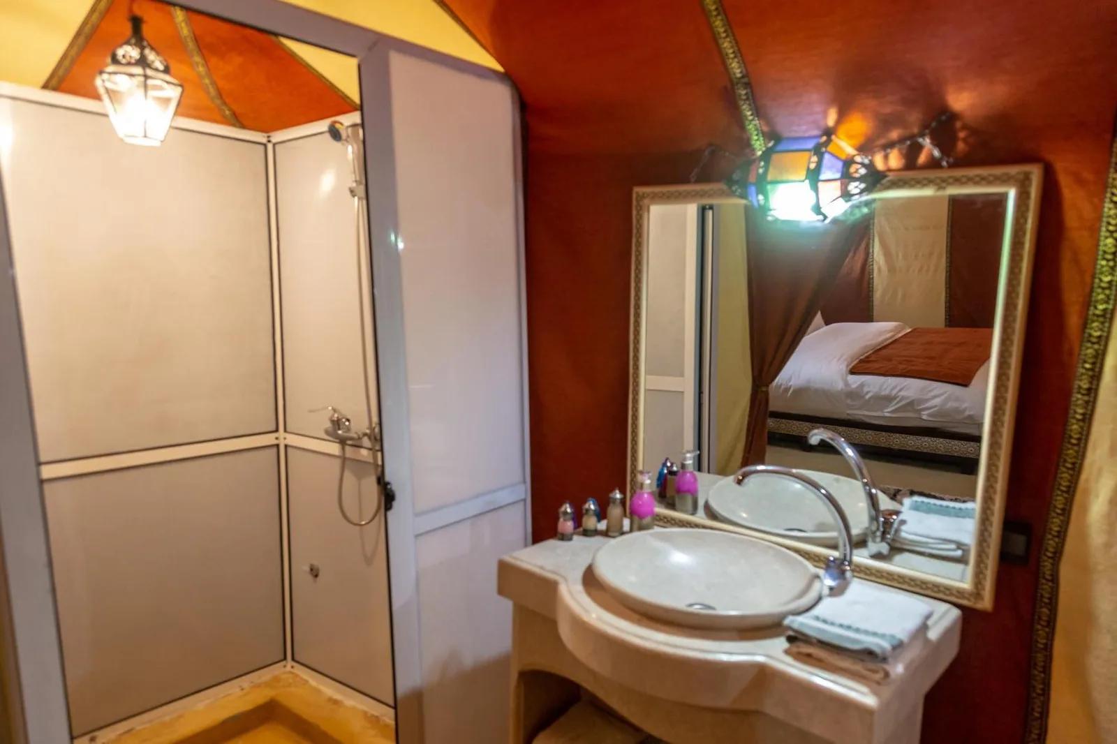 Private bathroom with shower and sink at Erg Chebbi Camp & Activities in Merzouga