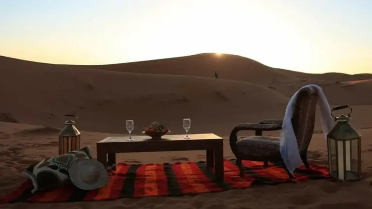 Private terrace seating area at Erg Chebbi Luxury Camp in Merzouga overlooking the desert dunes