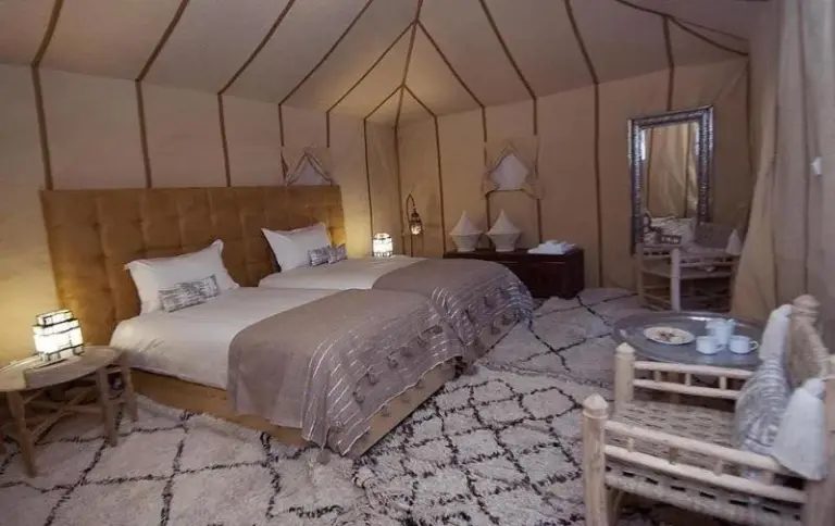 Erg Chebbi Traditional Experience & Activities in Merzouga luxury twin suite tent with carpeted seating area