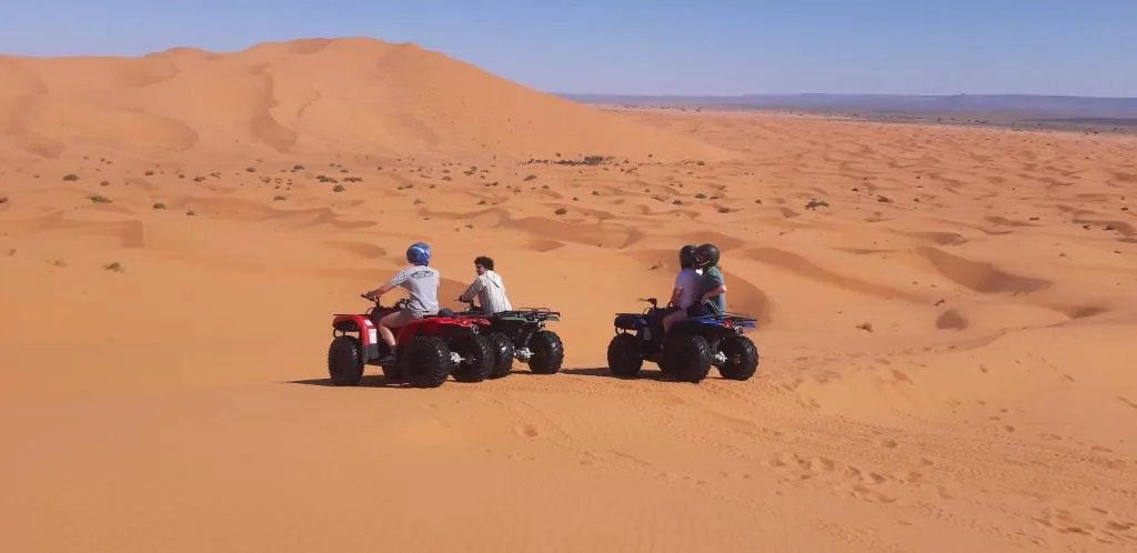 Erg Merzouga Desert Camp in Merzouga featuring quad biking activity